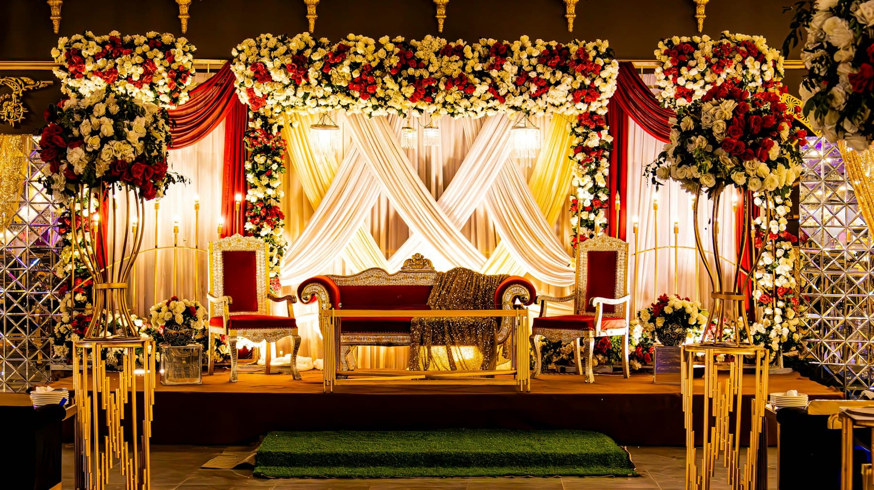 Wedding stage with florals and drapery